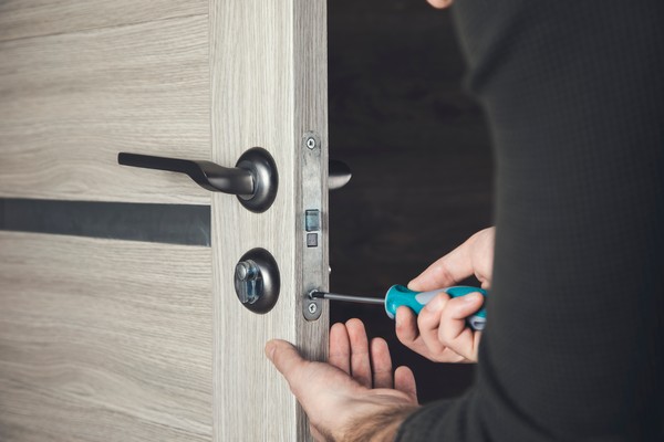 Professional locksmith installing a high-security lock in a Las Vegas residence