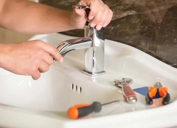 Expert plumber performing faucet repair in Las Vegas NV