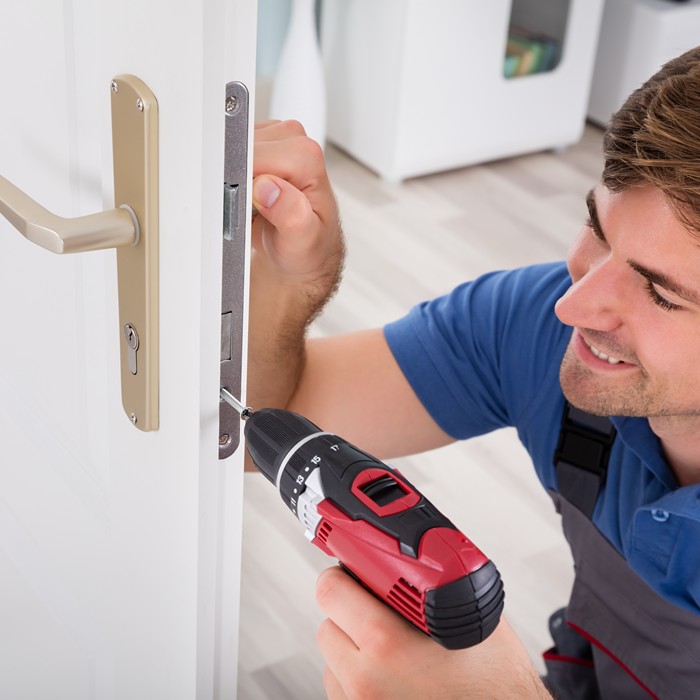 Residential locksmith rekeying locks for enhanced home security in Houston TX